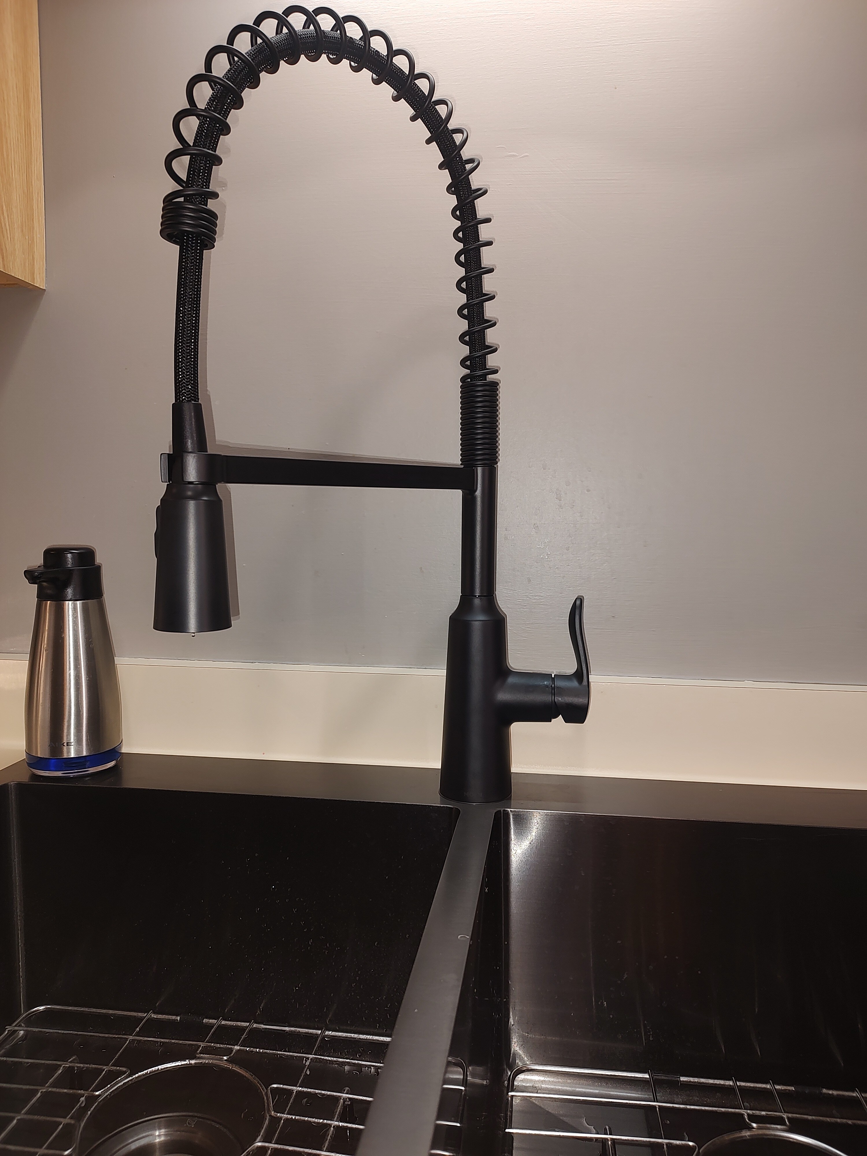 Black faucet installation in Rochester NY